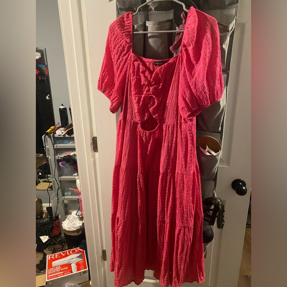 Pink dress with ruching in the front & a cut out